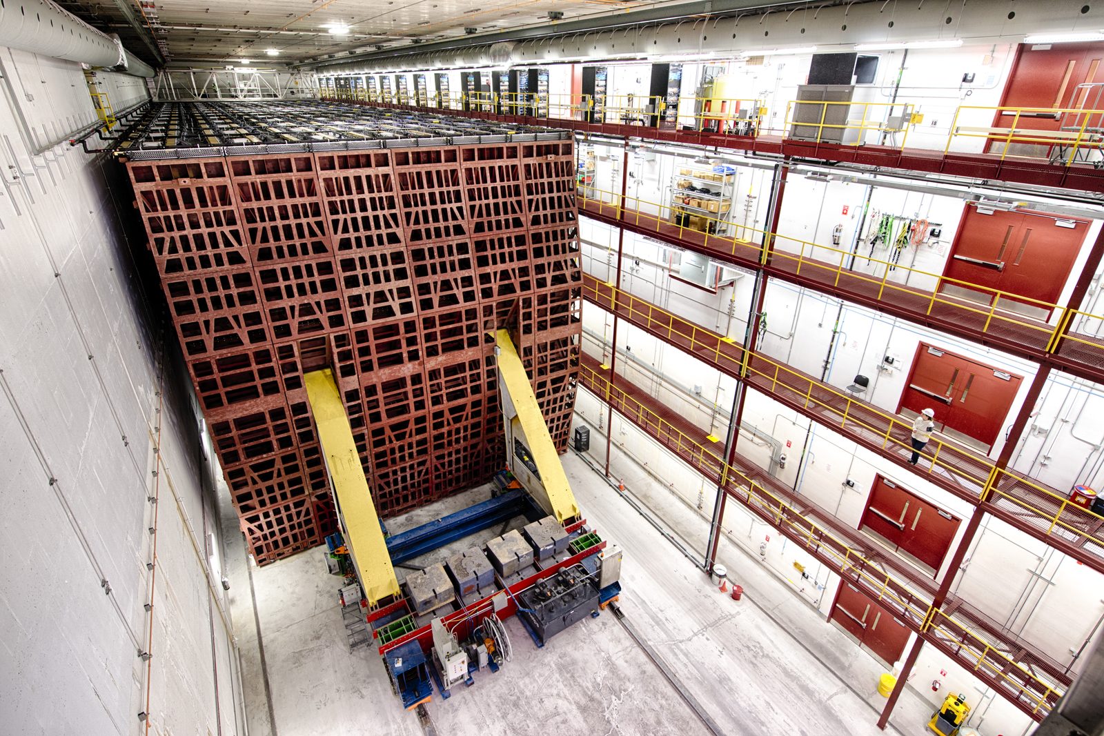 The 14-kilotonne NOvA far detector at Ash River, Minnesota, with a person at its base for scale.